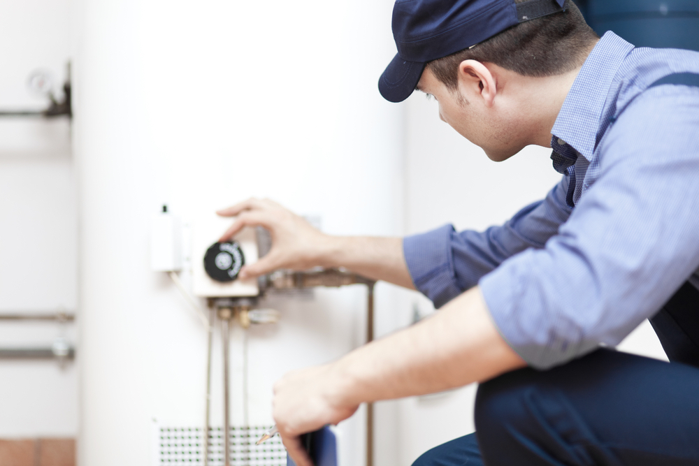 Plumber repairing a hot-water Heater