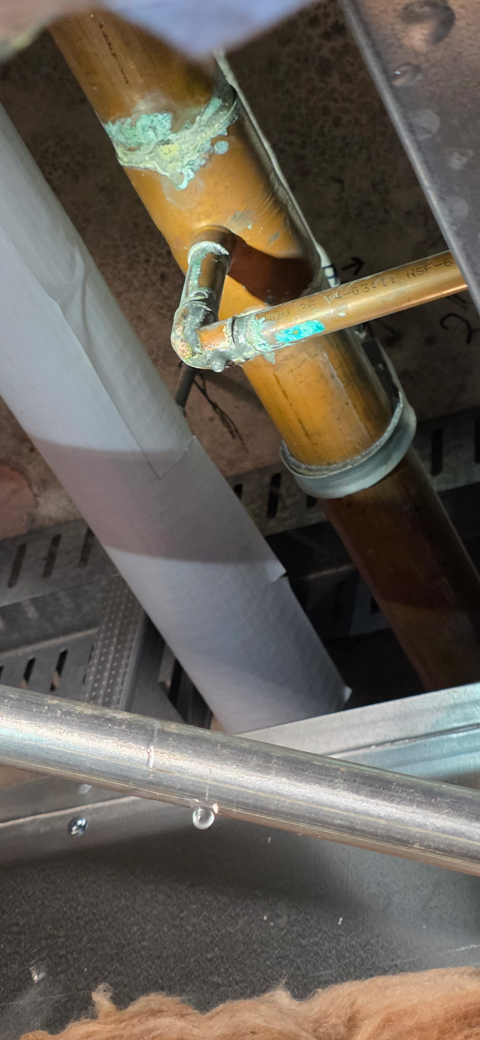 Before: Leaking overhead copper pipe